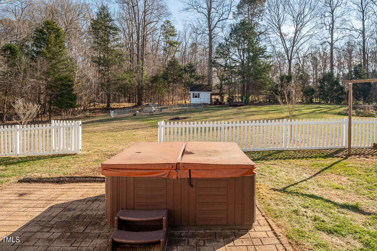 4552 Springbrook Drive Burlington, NC 27215 - Photo 33 of 57 a view of a backyard with large trees