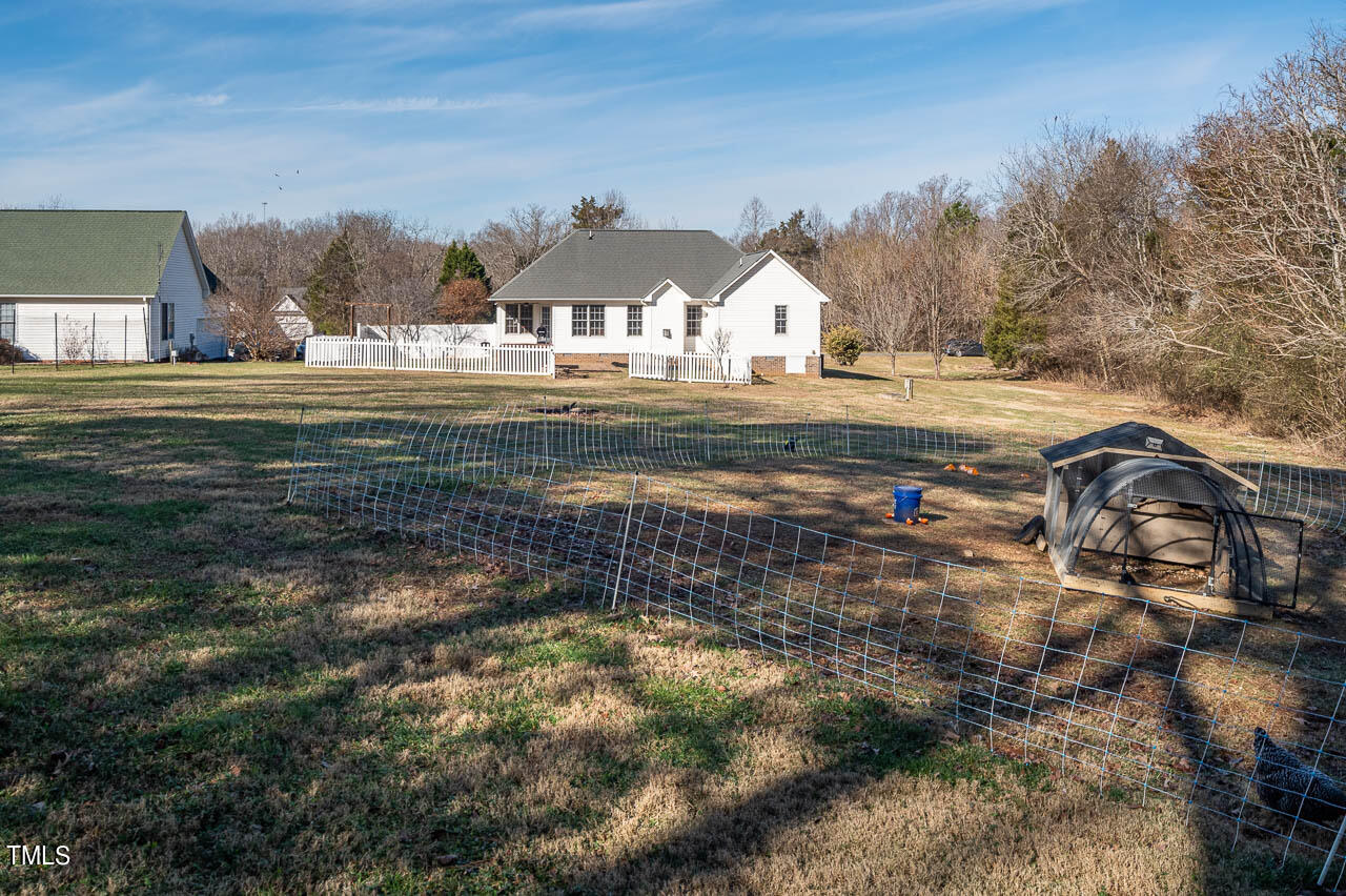 4552 Springbrook Drive Burlington, NC 27215 - Photo 41 of 57 a view of swimming pool with a yard and outdoor seating