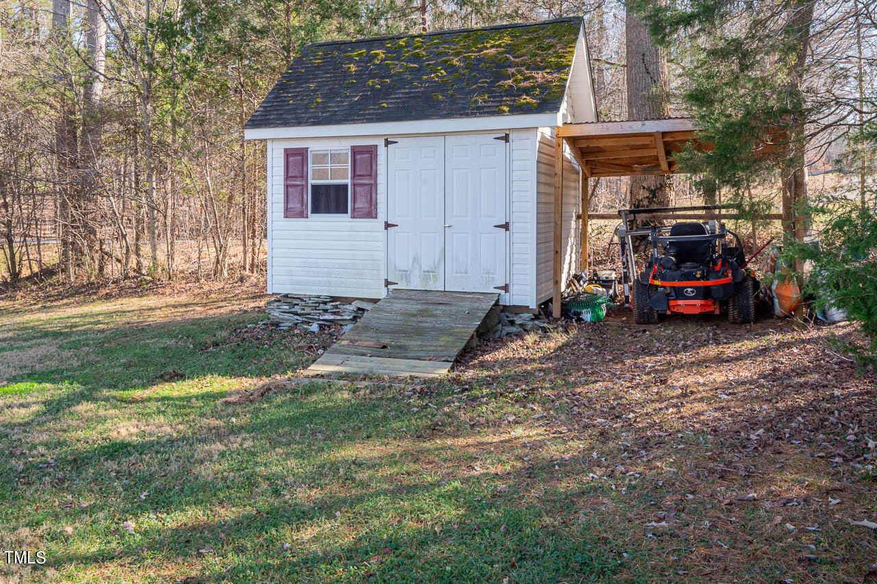 4552 Springbrook Drive Burlington, NC 27215 - Photo 42 of 57 a view of a house with a yard