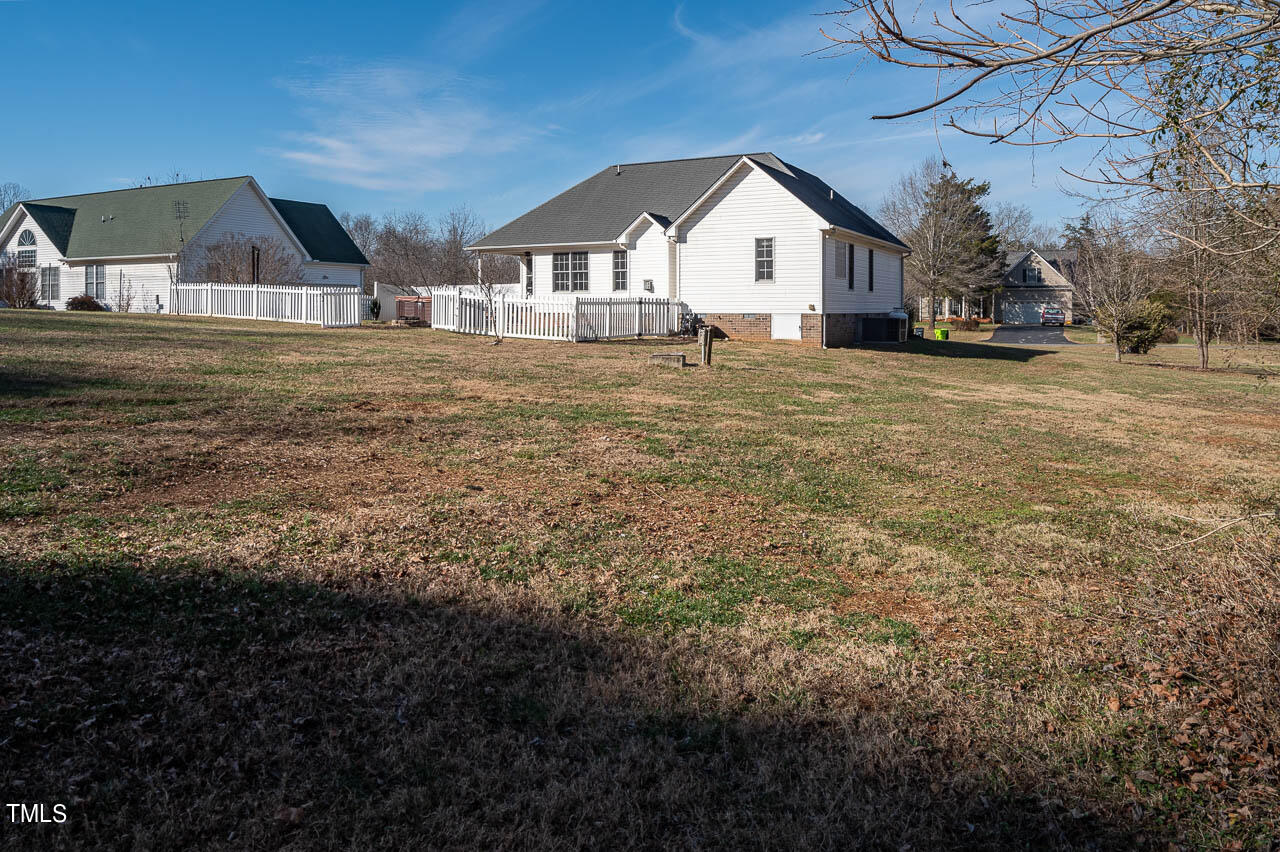 4552 Springbrook Drive Burlington, NC 27215 - Photo 44 of 57 a front view of a house with a yard