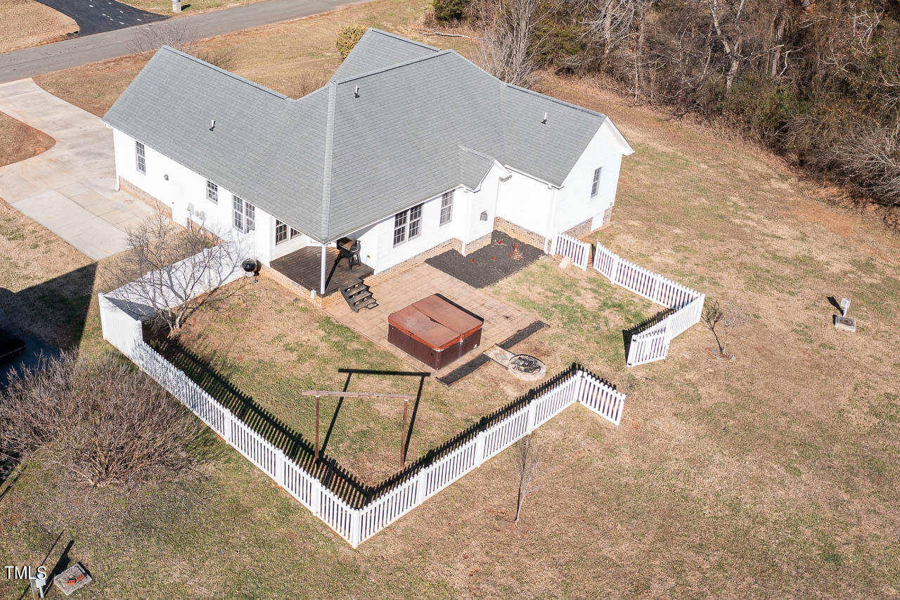 4552 Springbrook Drive Burlington, NC 27215 - Photo 48 of 57 an aerial view of a house with table and chairs