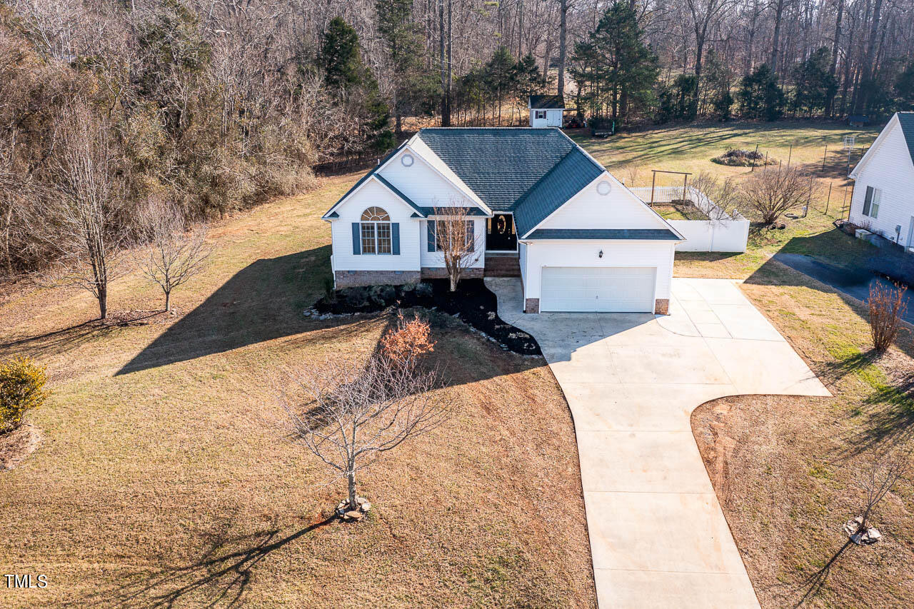 4552 Springbrook Drive Burlington, NC 27215 - Photo 5 of 57 a aerial view of a house with swimming pool and sitting area