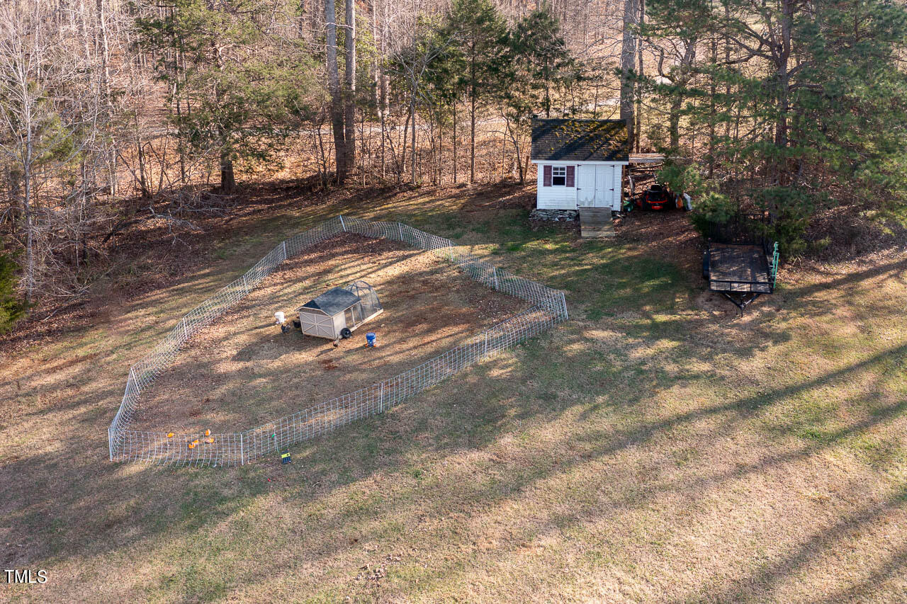 4552 Springbrook Drive Burlington, NC 27215 - Photo 52 of 57 a view of a chairs in a backyard