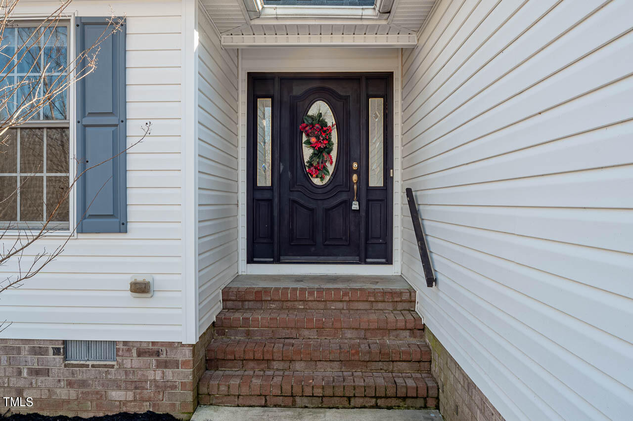 4552 Springbrook Drive Burlington, NC 27215 - Photo 7 of 57 a front view of a house with shower