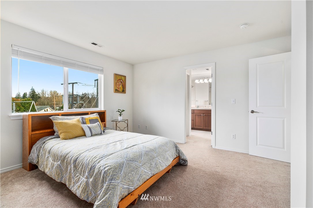 4024 Northeast 4th Place Renton, WA 98056 - Photo 17 of 29 a bedroom with a bed and a large window