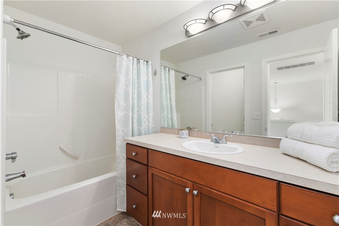 4024 Northeast 4th Place Renton, WA 98056 - Photo 21 of 29 a bathroom with a sink and a mirror