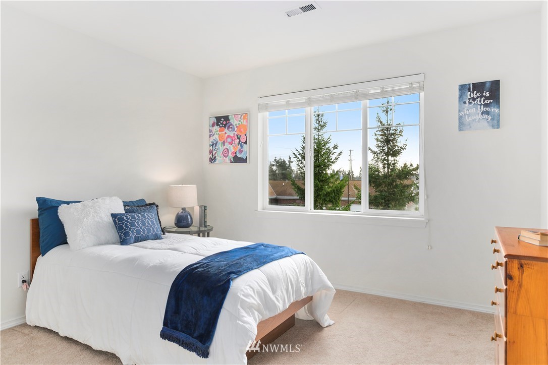 4024 Northeast 4th Place Renton, WA 98056 - Photo 22 of 29 a bedroom with a bed and a window