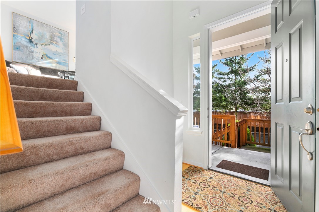 4024 Northeast 4th Place Renton, WA 98056 - Photo 4 of 29 a view of staircase with lots of frames on wall and a large window