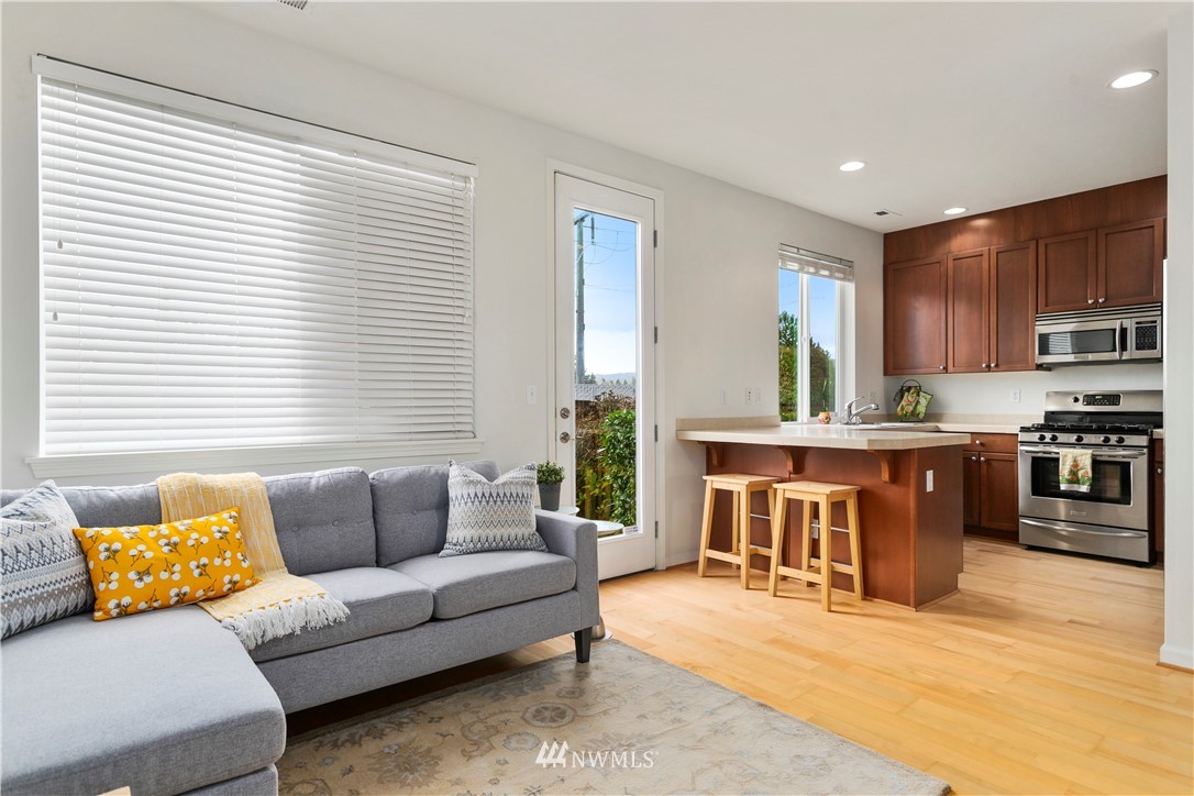 4024 Northeast 4th Place Renton, WA 98056 - Photo 10 of 29 a living room with a couch and a window