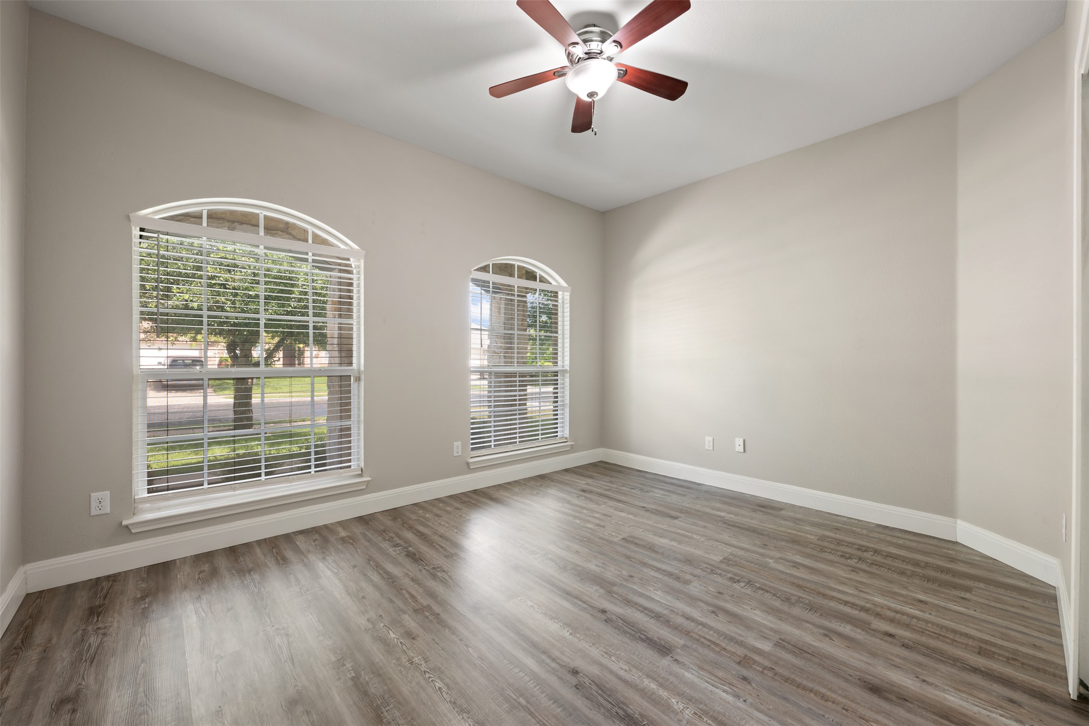 18820 Edinburgh Castle Road Pflugerville, TX 78660 - Photo 29 of 37 a view of an empty room with wooden floor and a window