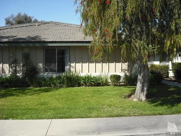 a view front of house with a garden