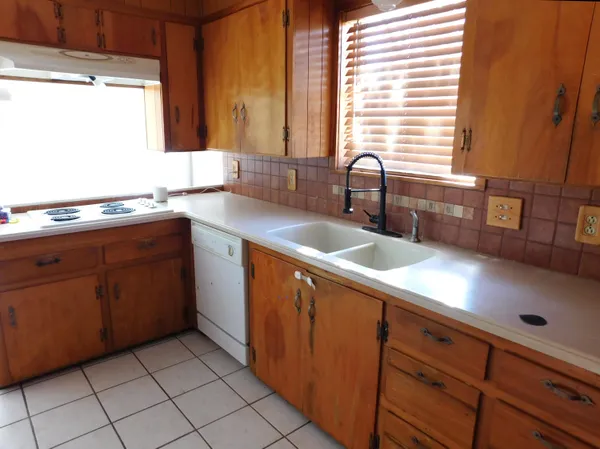 a kitchen with a sink and cabinets