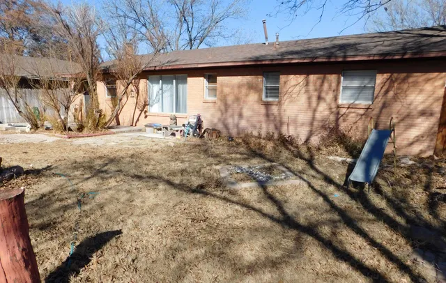 a view of a backyard of the house