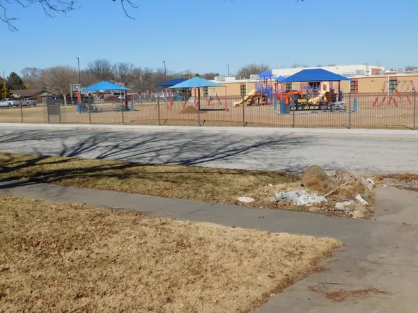 a front view of house with yard and trees
