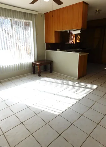 a kitchen with stainless steel appliances kitchen island granite countertop a sink and a stove