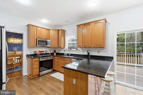 a kitchen with lots of counter top space and sink