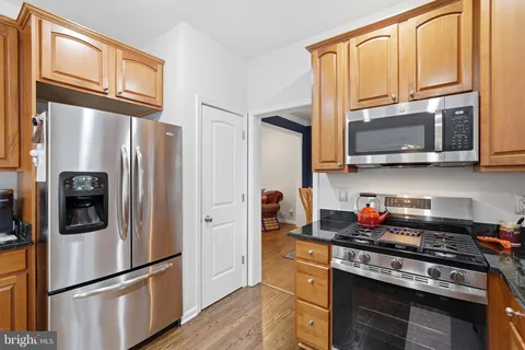 a living room with furniture fireplace and a flat screen tv