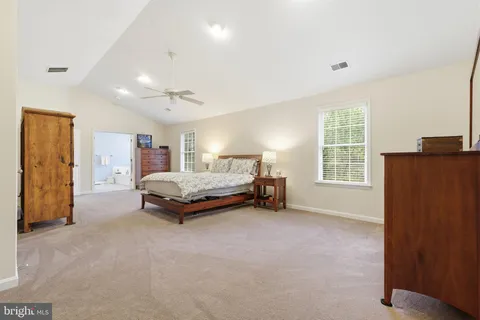 a room with a window and a chandelier