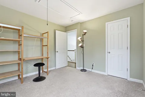 a room with gym equipment and a flat screen tv