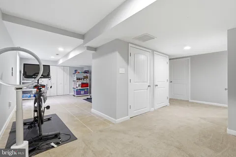 a view of a roof deck with wooden fence and floor