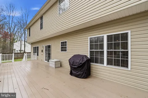 a view of a backyard with wooden fence