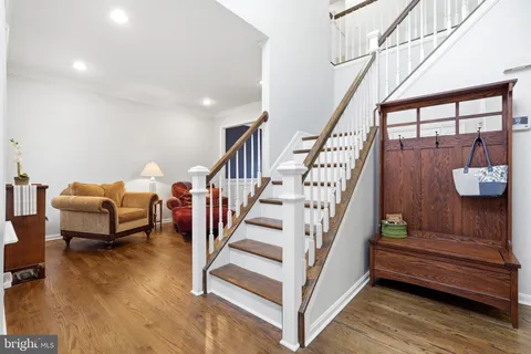a bedroom with furniture and wooden floor