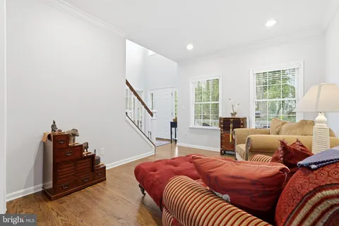 a view of a dining room with furniture wooden floor and chandelier