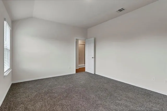 a view of an empty room and window