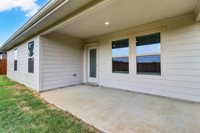a view of front door and yard