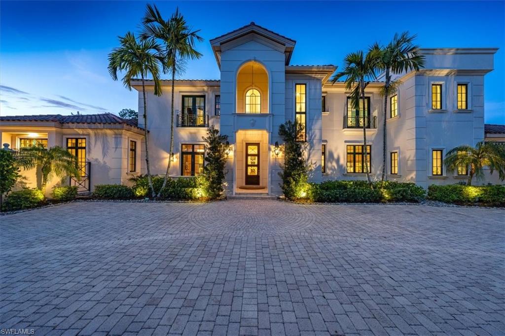 6547 Highcroft Drive Naples, FL 34119 - Photo 1 of 50 a front view of a house with a yard