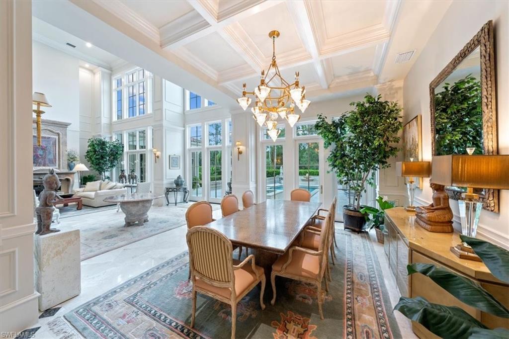 6547 Highcroft Drive Naples, FL 34119 - Photo 6 of 50 a outdoor dining space with furniture