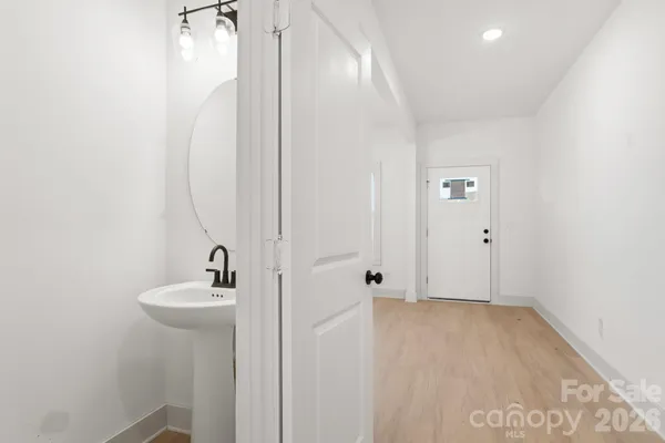 a bathroom with a sink a mirror and shower