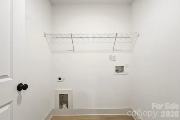 a view of a room with racks on the wall