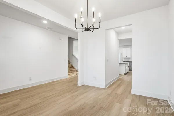 a view of a chandelier in an empty room