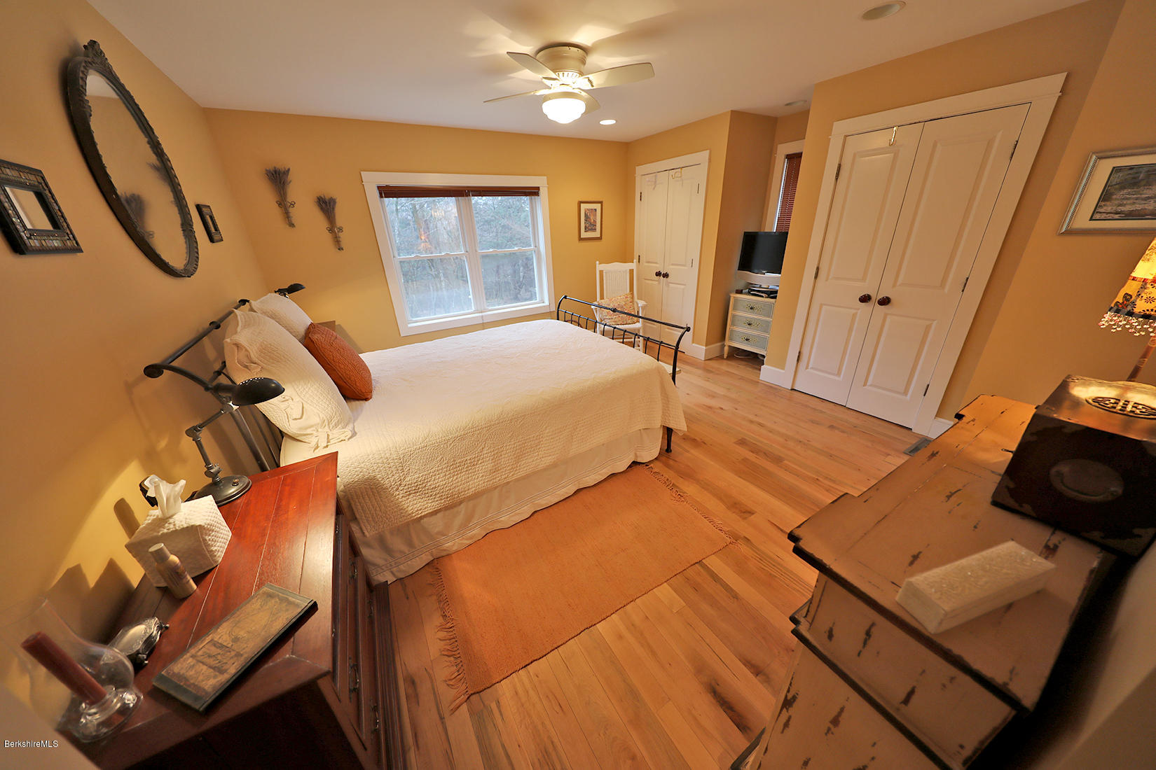 515 Ed Jones Road Otis, MA 01253 - Photo 14 of 21 a bedroom with a bed and wooden floor
