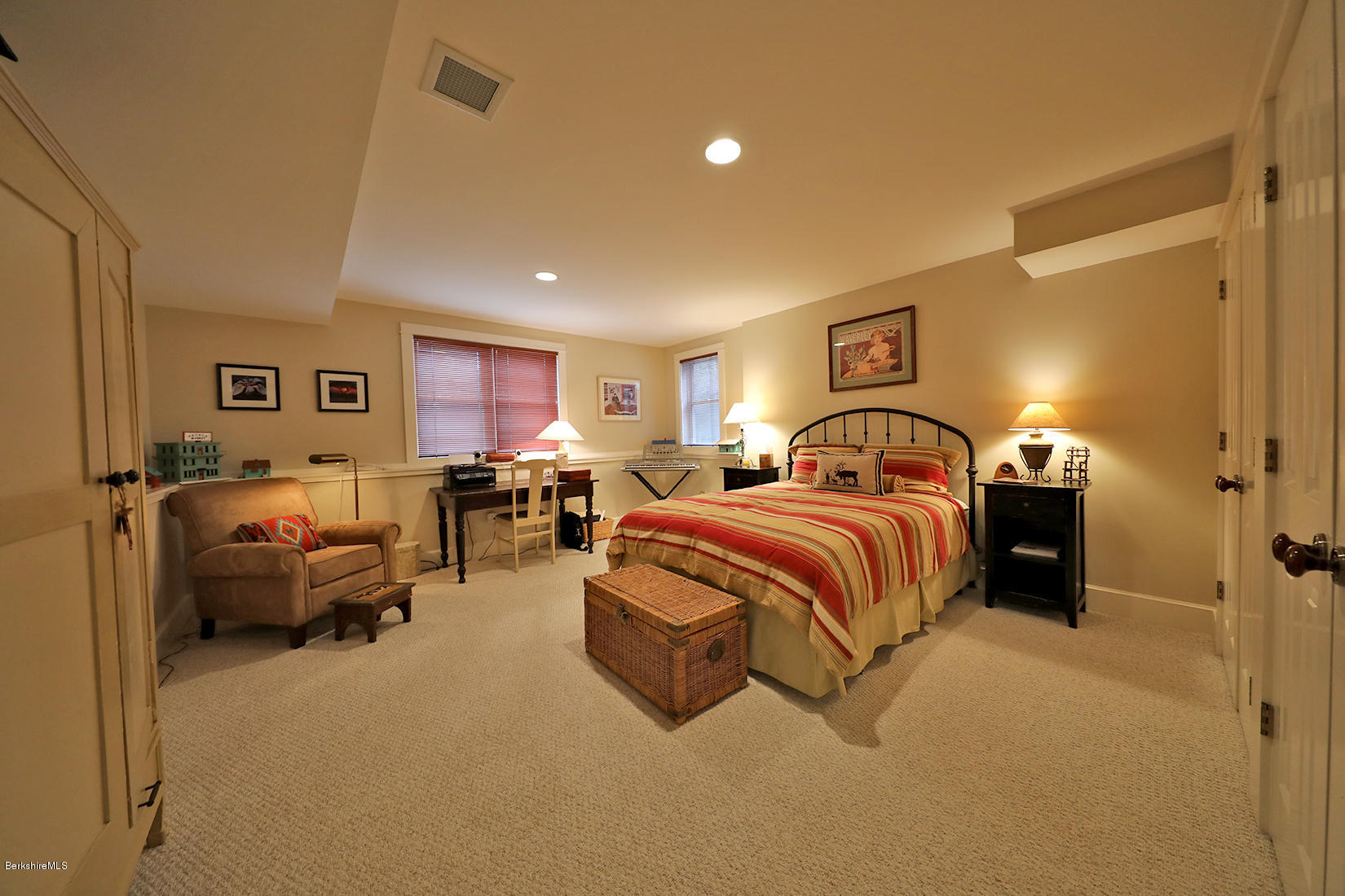515 Ed Jones Road Otis, MA 01253 - Photo 16 of 21 a spacious bedroom with a bed and a couch