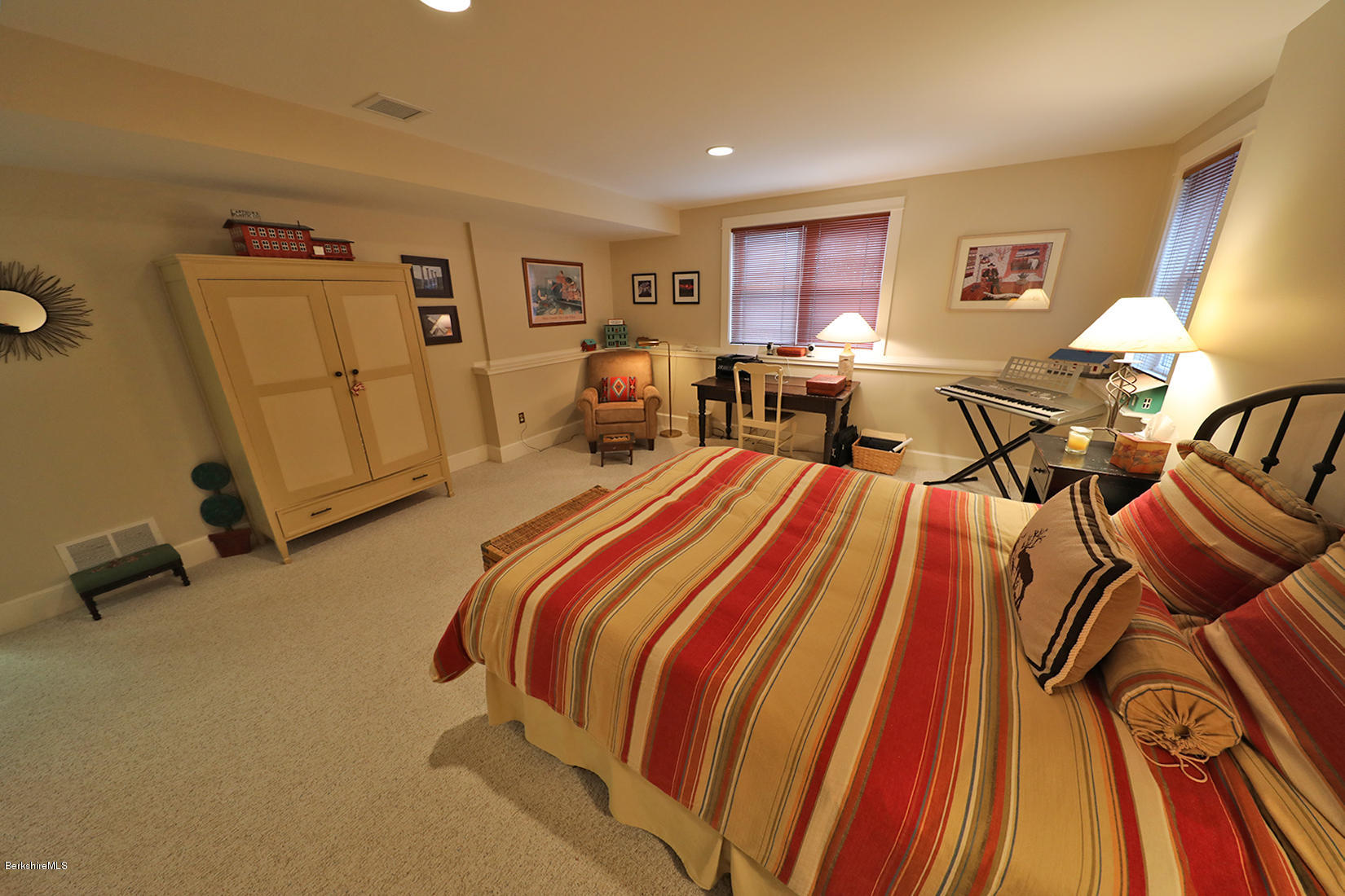 515 Ed Jones Road Otis, MA 01253 - Photo 17 of 21 a bedroom with a bed and wooden floor
