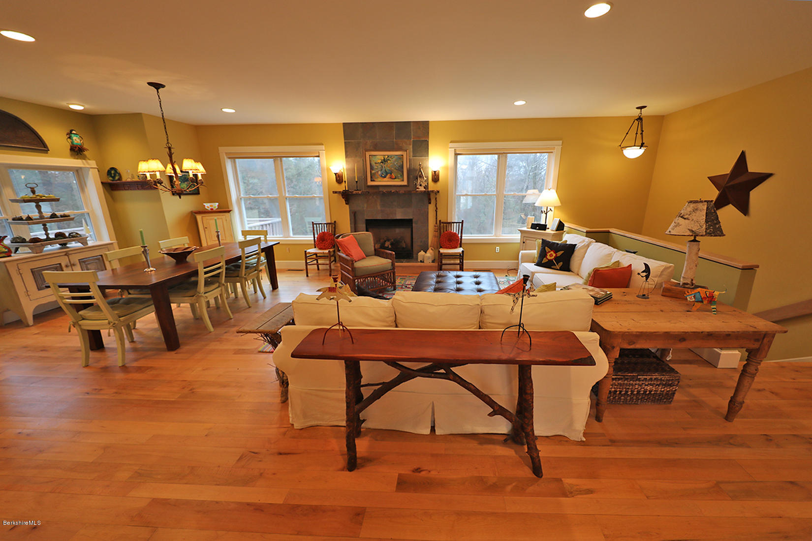 515 Ed Jones Road Otis, MA 01253 - Photo 4 of 21 a living room with lots of furniture and a dining table