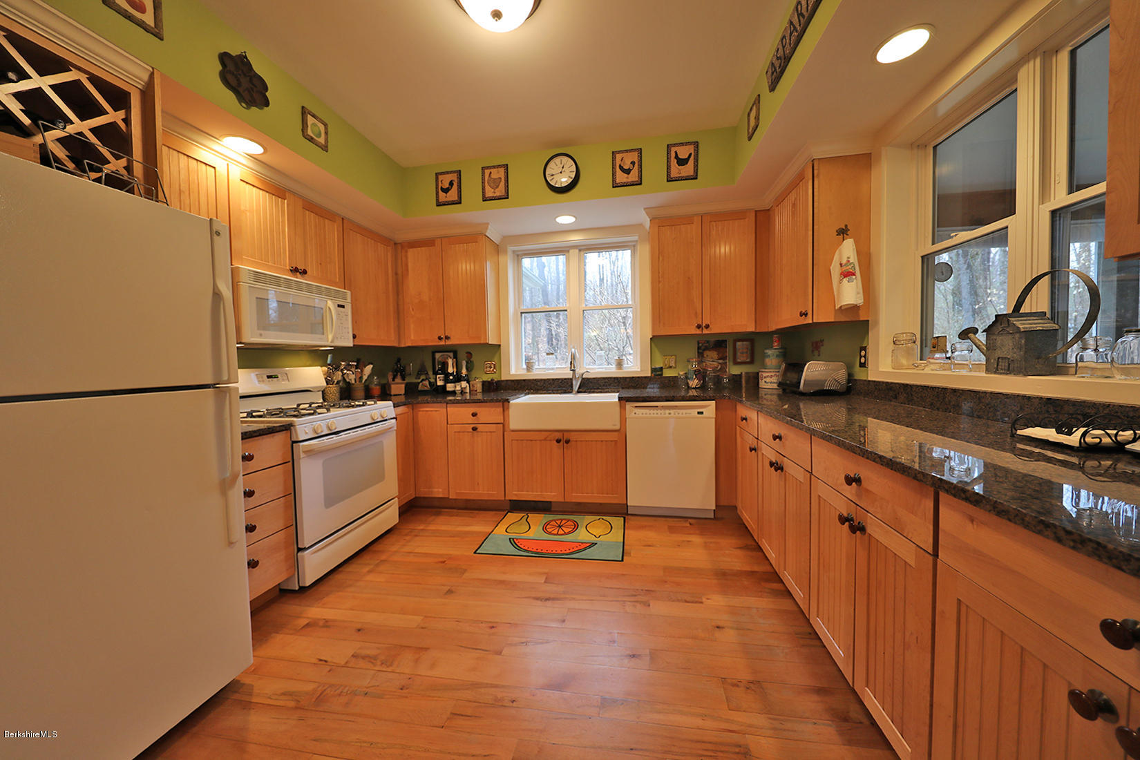 515 Ed Jones Road Otis, MA 01253 - Photo 7 of 21 a kitchen with stainless steel appliances granite countertop a stove a sink dishwasher and a refrigerator