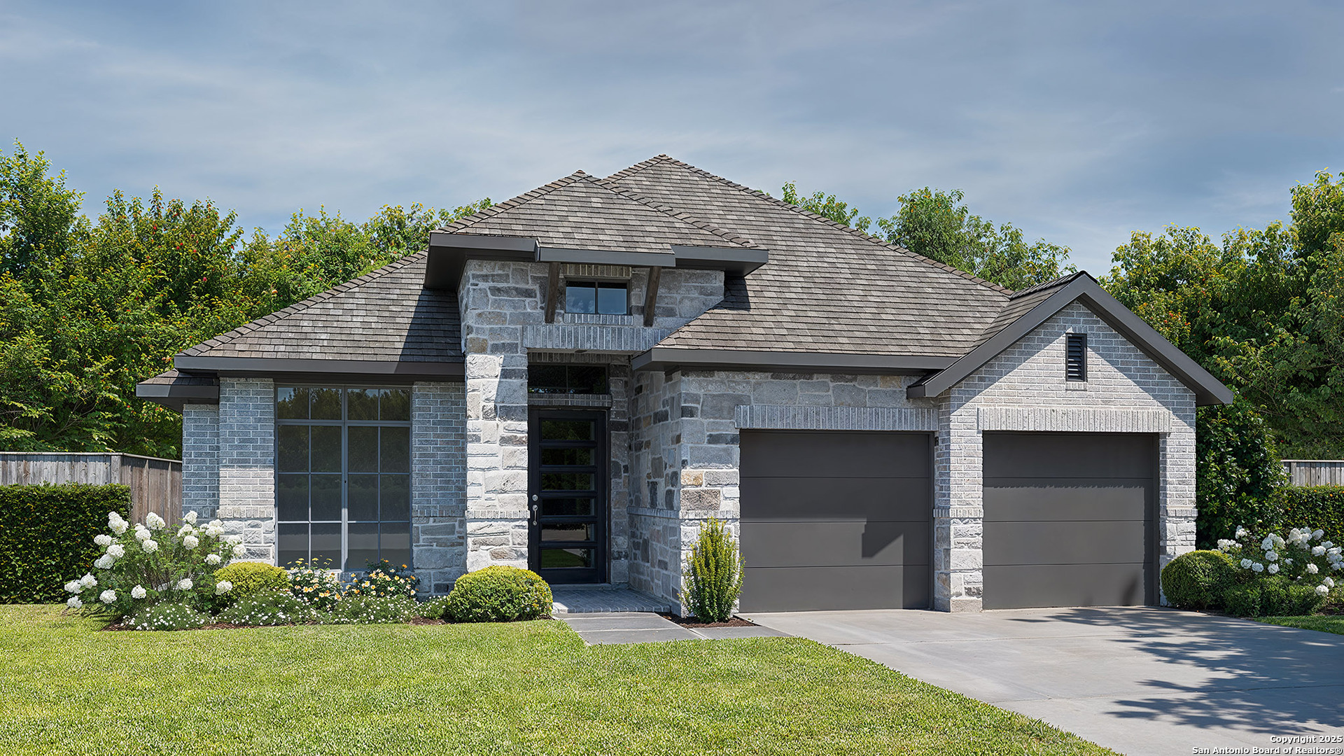 a front view of a house with garden