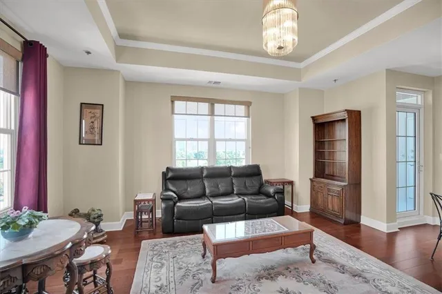 a living room with stainless steel appliances kitchen island granite countertop furniture and a kitchen view