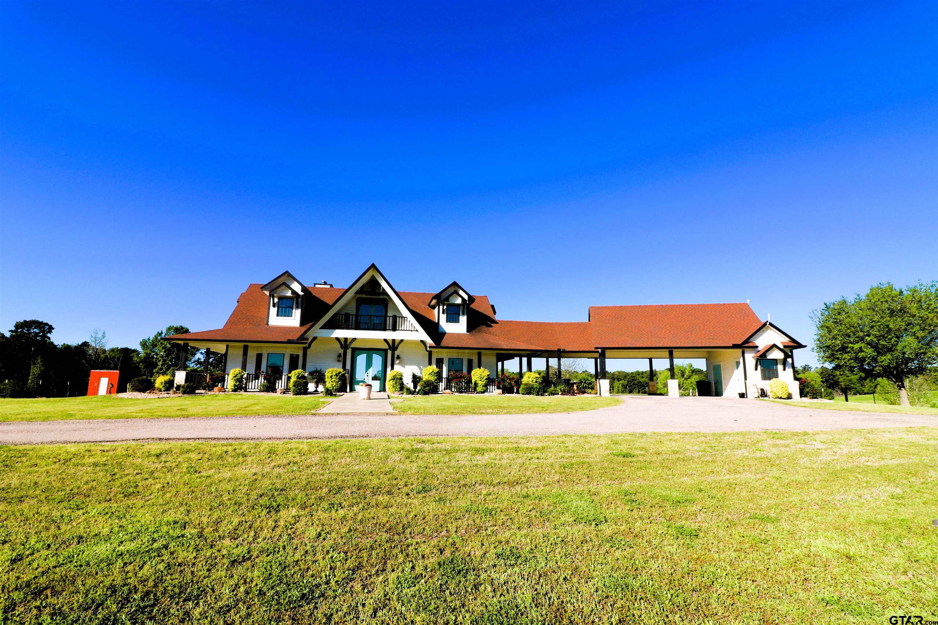 a front view of a building with an ocean view