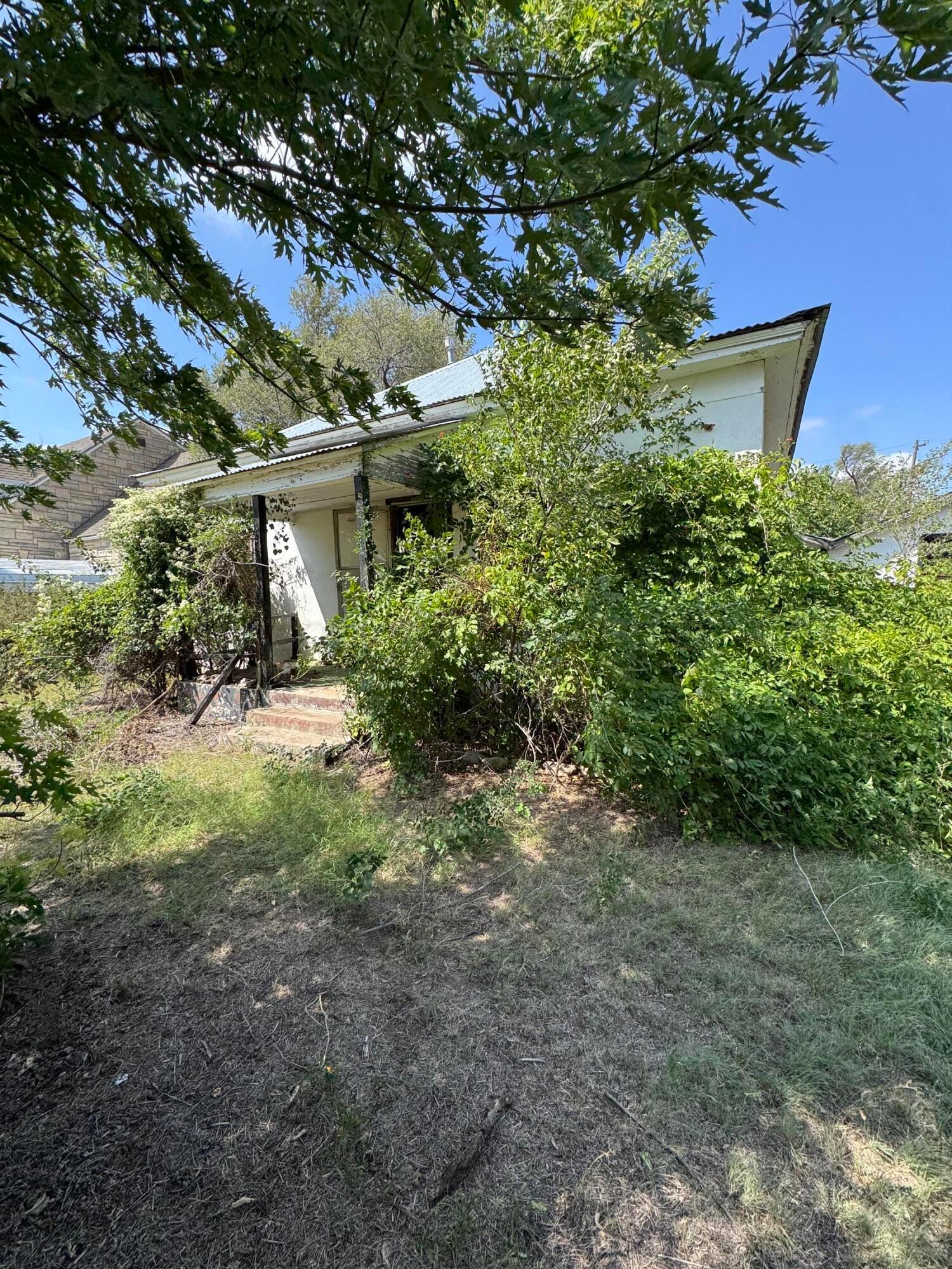 a view of a house with a tree