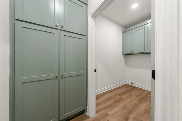 a kitchen with stainless steel appliances granite countertop a sink stove and wooden floor