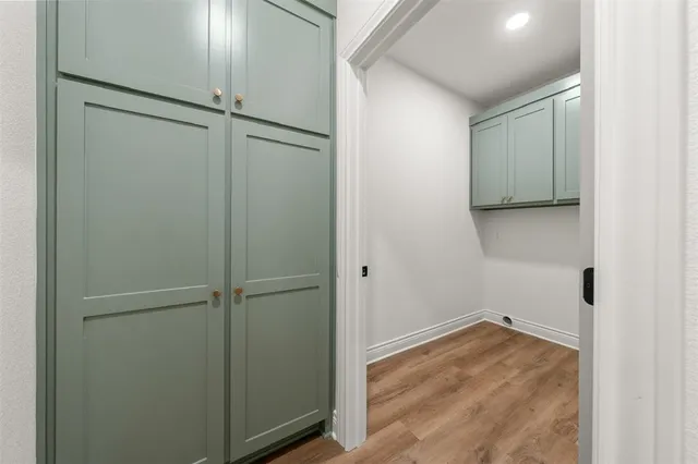 a kitchen with stainless steel appliances granite countertop a sink stove and wooden floor
