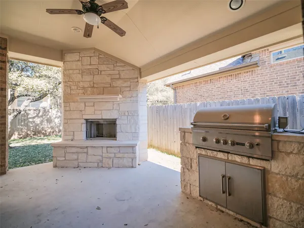 a kitchen with a stove and a fireplace