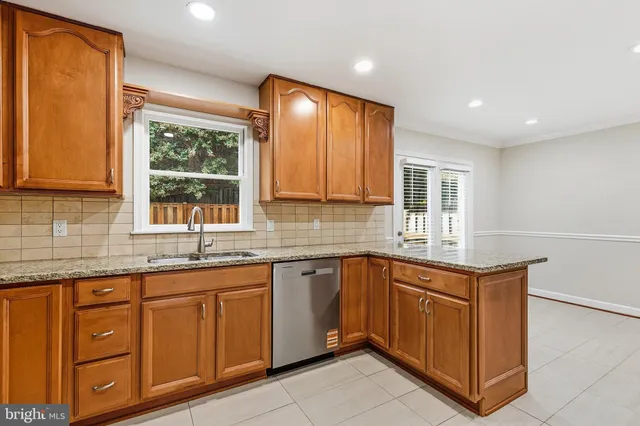 a kitchen with a refrigerator stove and microwave