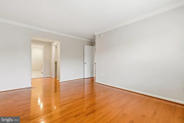 a bathroom with a walk in closet and mirror