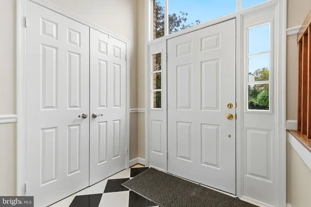 a view of a livingroom with wooden floor and a fireplace
