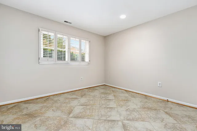 a view of balcony with wooden floor and fence